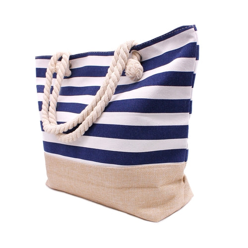 Stylish woman holding navy rope handle beach tote