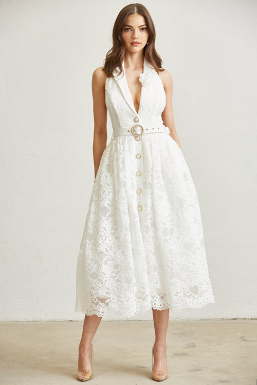 Full view of lace halter dress with pearl belt styled outdoors
