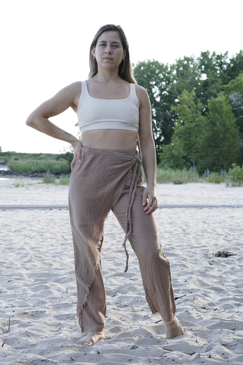 Woman wearing boho organic cotton pants in a natural setting