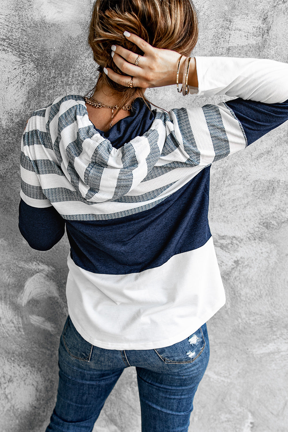 Casual women's hoodie styled with jeans and boots