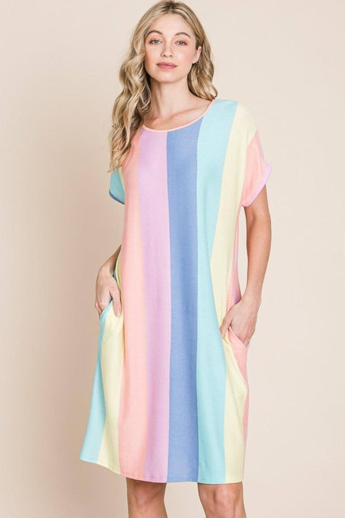 Woman wearing striped short sleeve dress with side pockets