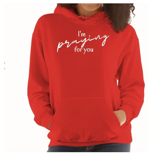 Flat lay of hoodie with Bible and journal