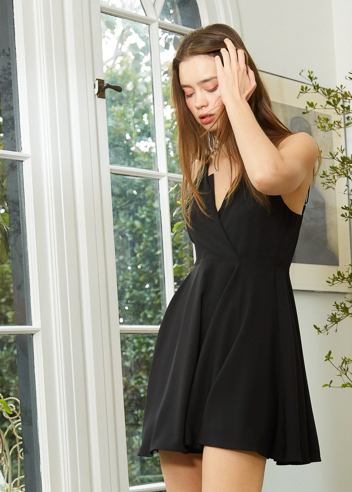 Soft polyester black cocktail dress on display