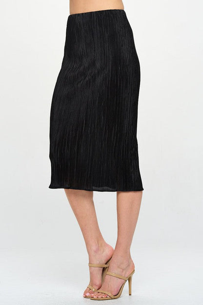 Woman wearing solid plissé midi skirt styled for office