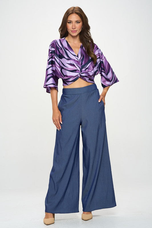 Model standing in oversized wide leg trousers with pockets