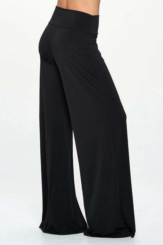 Side profile of model in Made in USA wide leg trousers