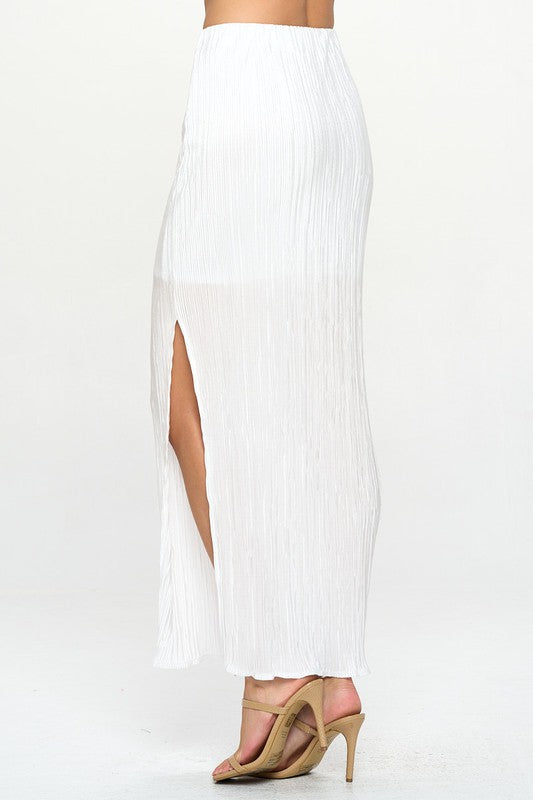 Flowing pleated skirt with side slit detail