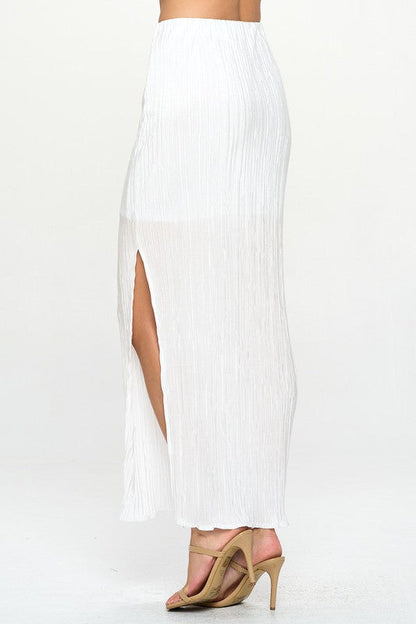 Flowing pleated skirt with side slit detail