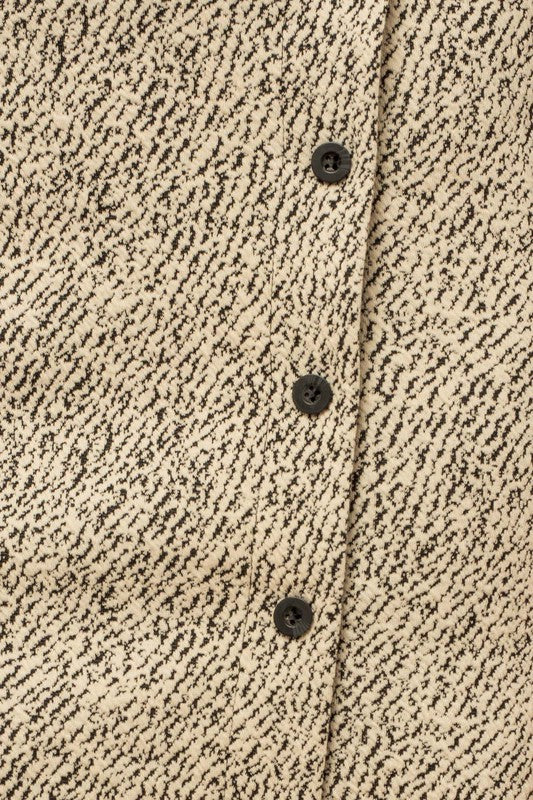 Button down mini skirt paired with crop top and sneakers