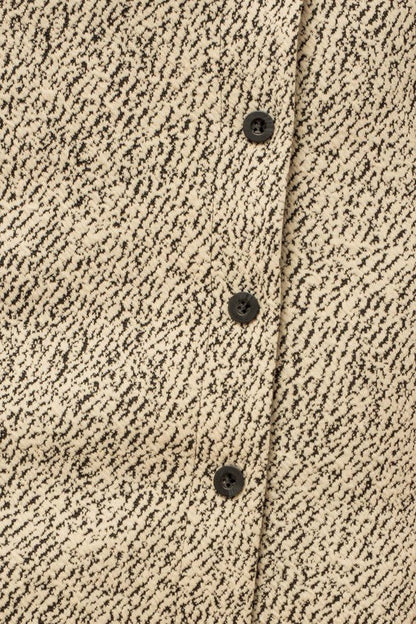 Button down mini skirt paired with crop top and sneakers