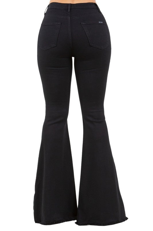 Back view of high-stretch bell bottom jeans with pockets