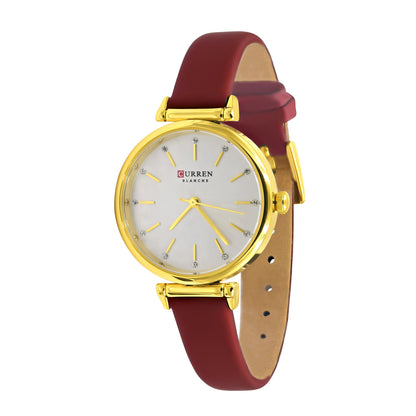 Women's executive Curren watch displayed with accessories