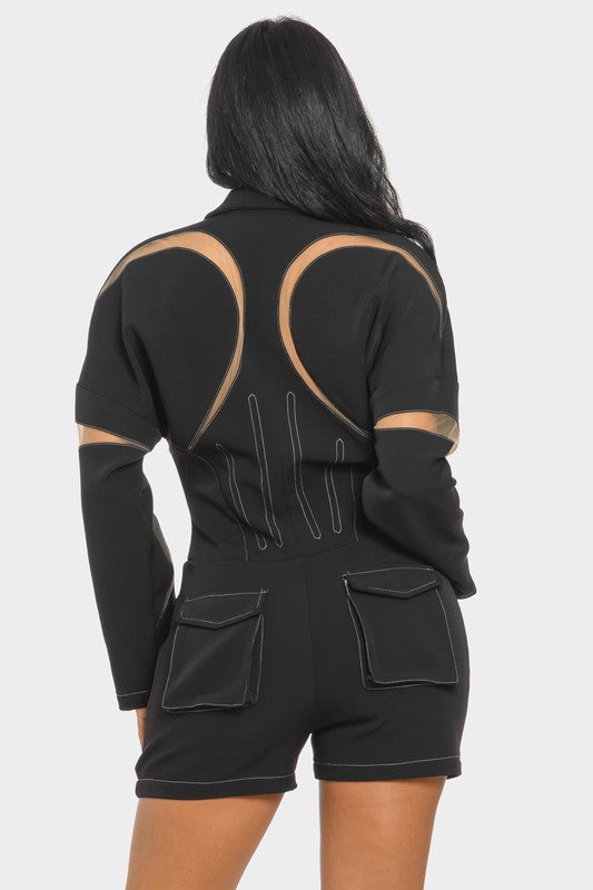 Modern black romper featuring bold mesh inserts and sleek fit
