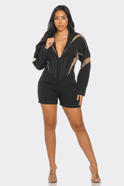 Front view of tailored mesh-panelled black romper with zipper closure