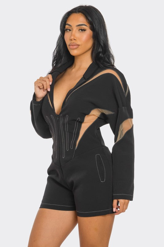 Side view of a mesh-panelled black romper styled 