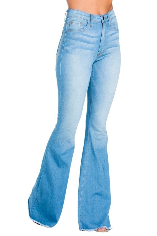 Flat lay of Logan high stretch bell bottoms on neutral background