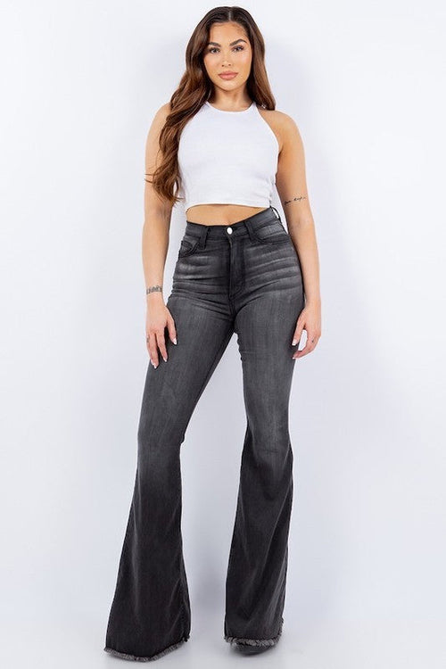 Full-length photo of model wearing Jess bell bottom jeans