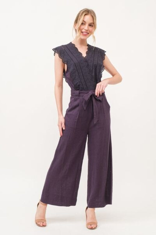 Front view of elegant tie waist jumpsuit with pockets