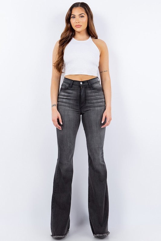 Flat lay of wide-leg corduroy jeans with frayed hem detail