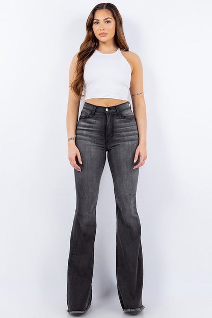 Flat lay of wide-leg corduroy jeans with frayed hem detail