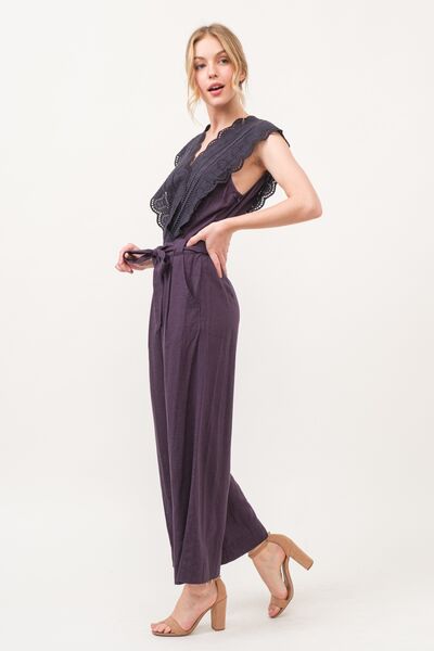 Side view of breathable rayon-linen jumpsuit with surplice neckline