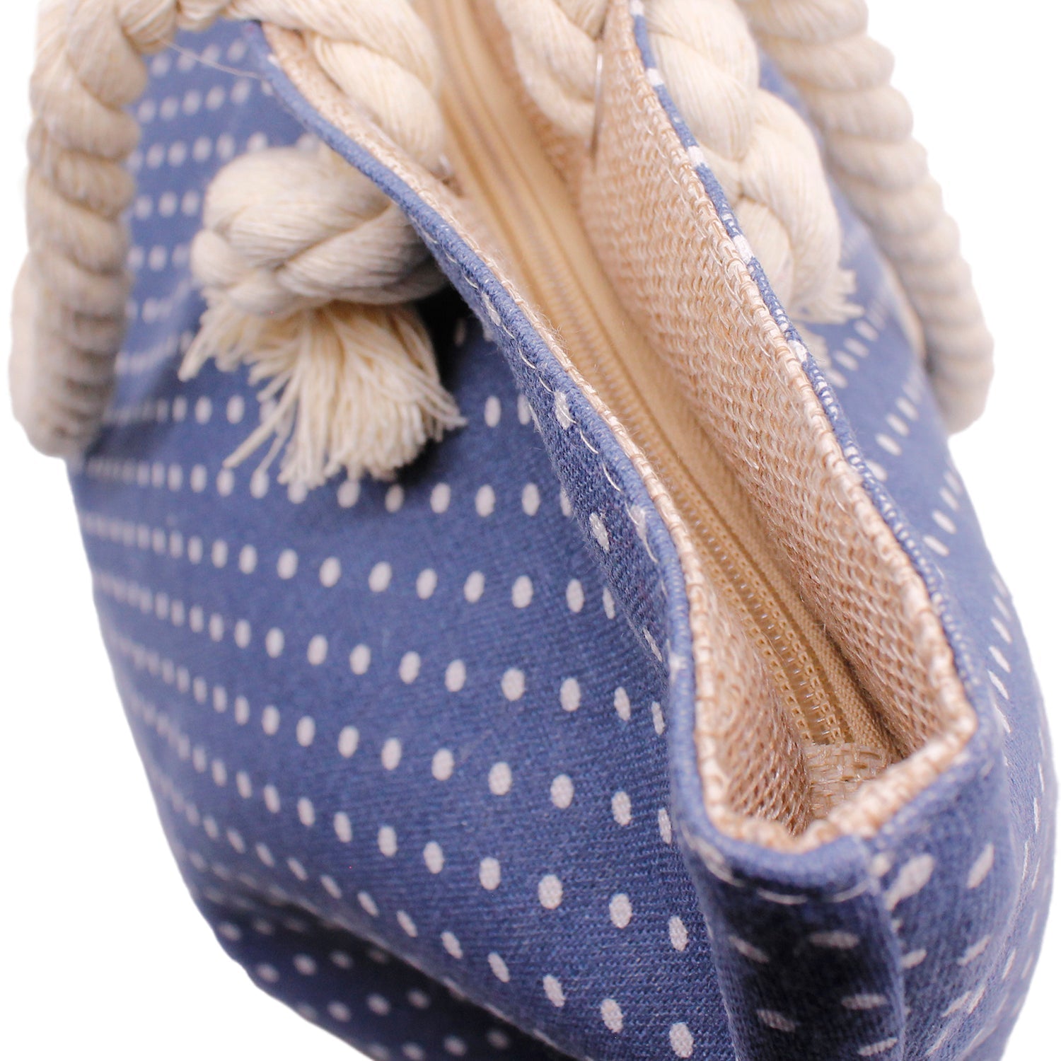 Close-up of polka dot beach bag with nautical rope handles
