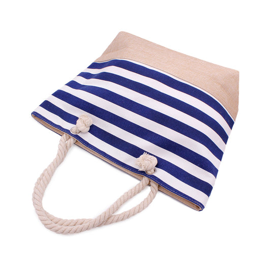 Classic navy stripe beach tote with rope handles on sand