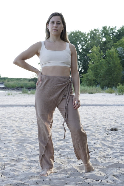 Woman wearing boho organic cotton pants in a natural setting