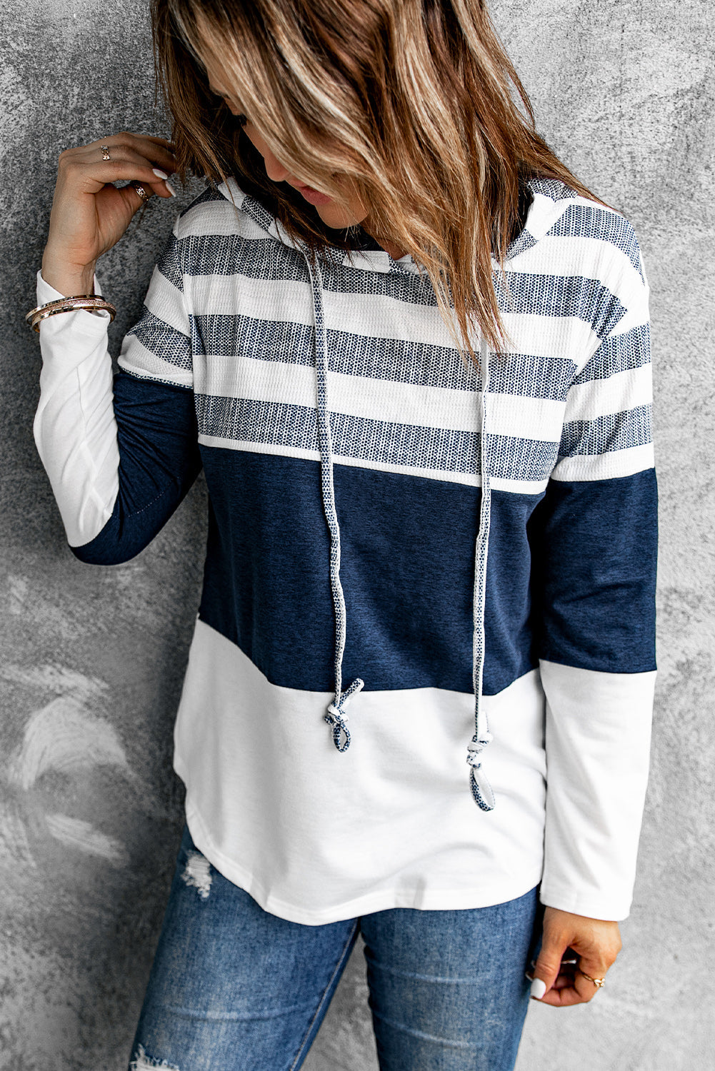 Side view of long-sleeve white pullover hoodie