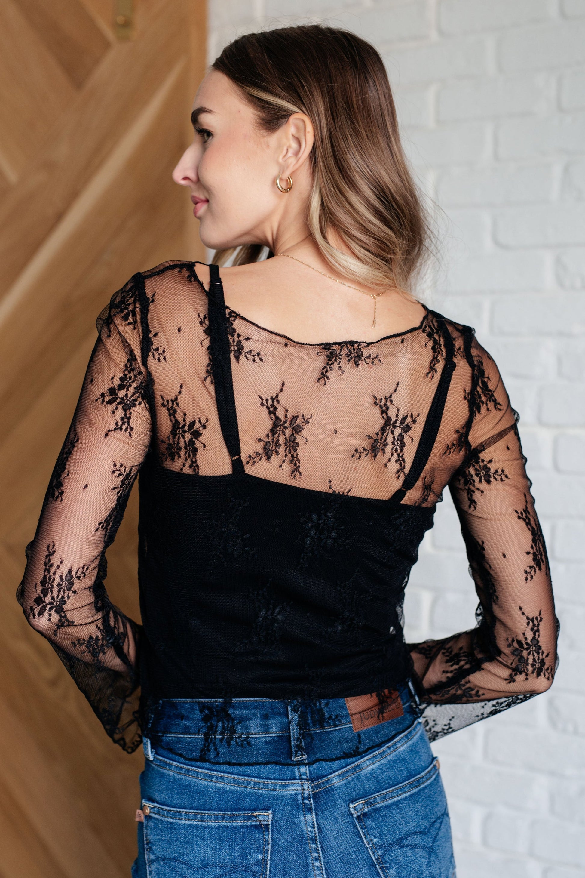 Back view of black lace tank – adjustable strap detail