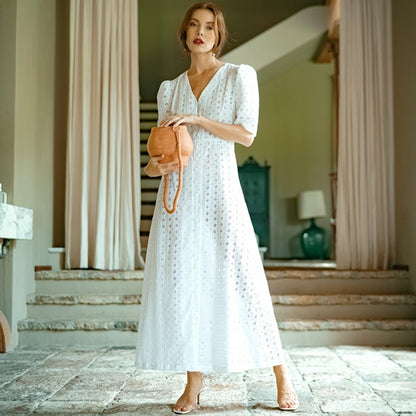 Elegant white summer dress with vintage-style clover accents