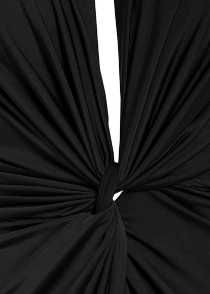 Close-up of knot detail on black midi bodycon dress