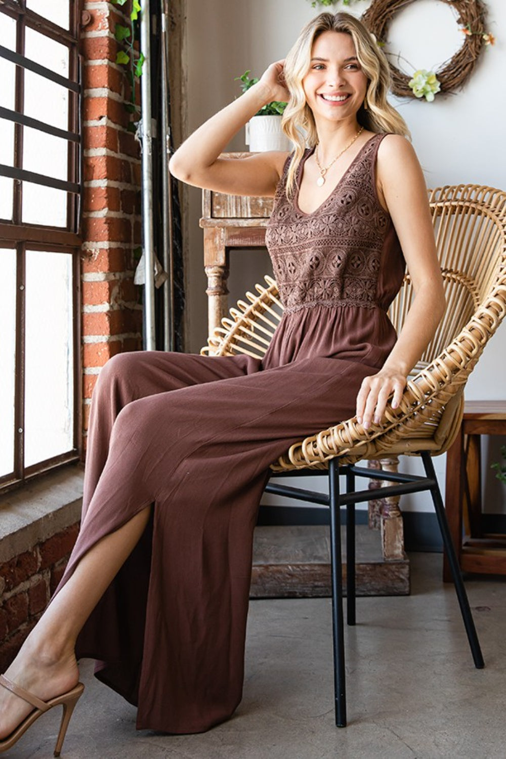 Woman wearing First Love sleeveless wide leg jumpsuit