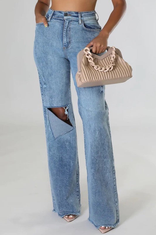 Model wearing Tyger Wide Leg Jean with stone wash finish