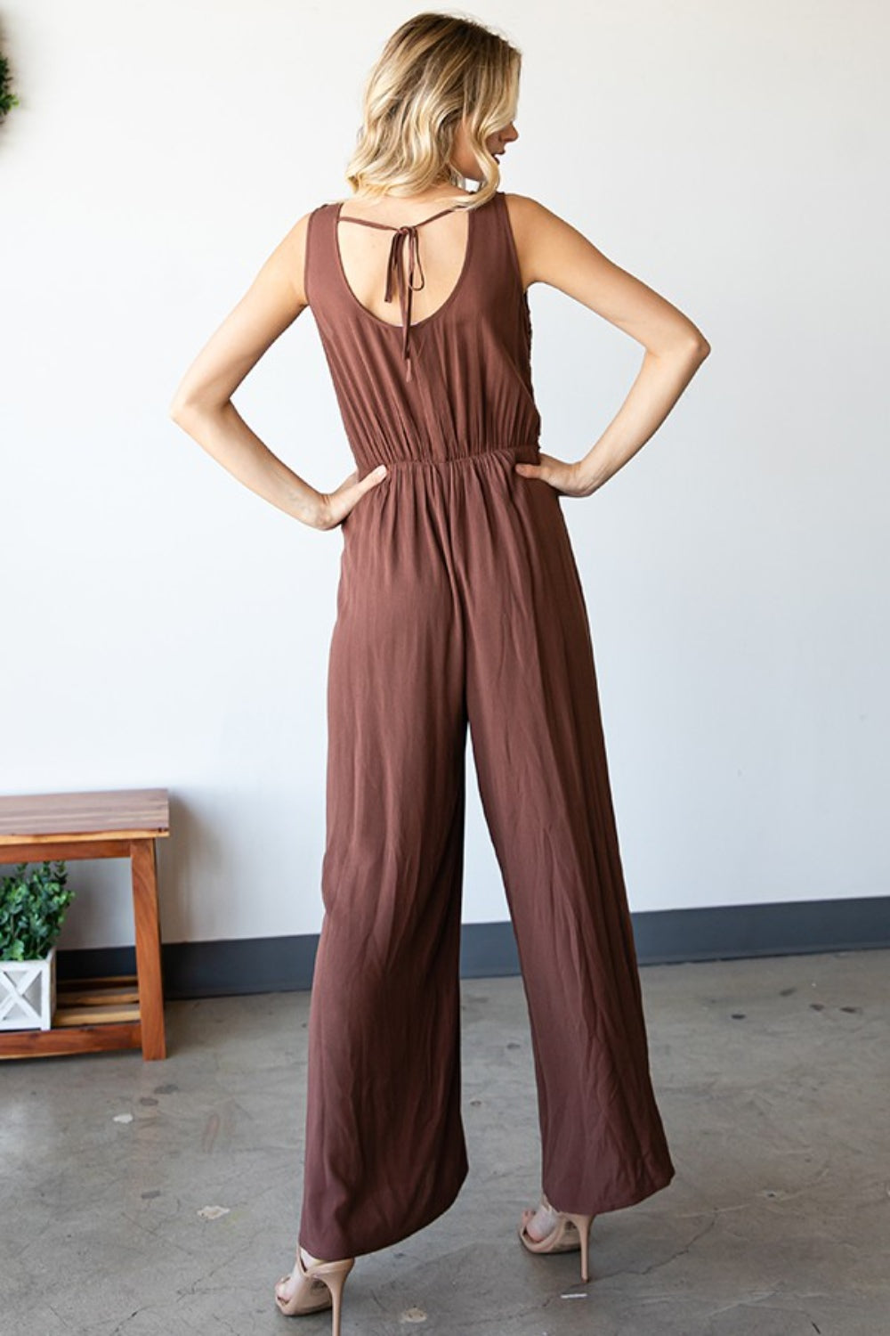 Back view of tie back detail on rayon jumpsuit