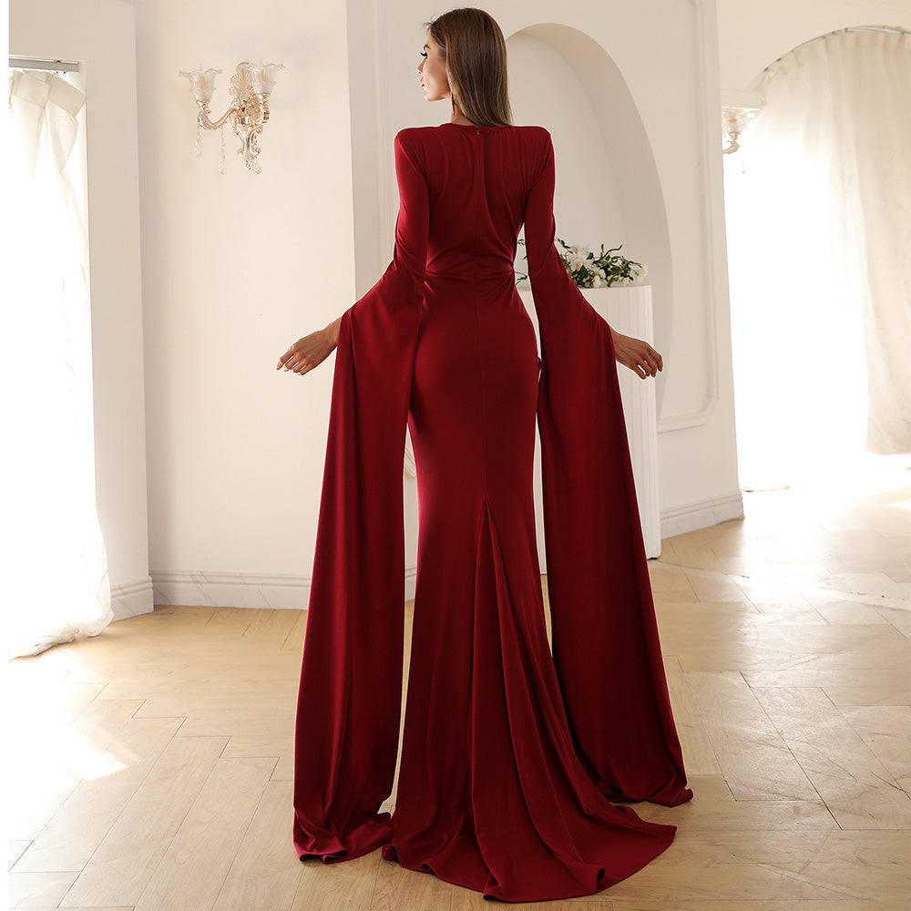 Close-up of neckline and sleeve detail on Chloe solid formal gown