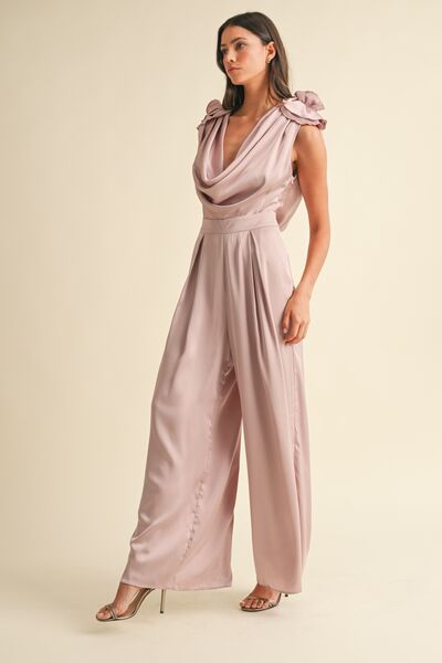 Full-body shot of flowy wide-leg jumpsuit for evening wear