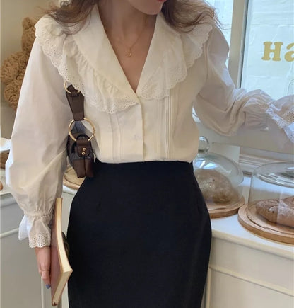 Woman wearing vintage-style embroidered cotton blouse with pagoda sleeves