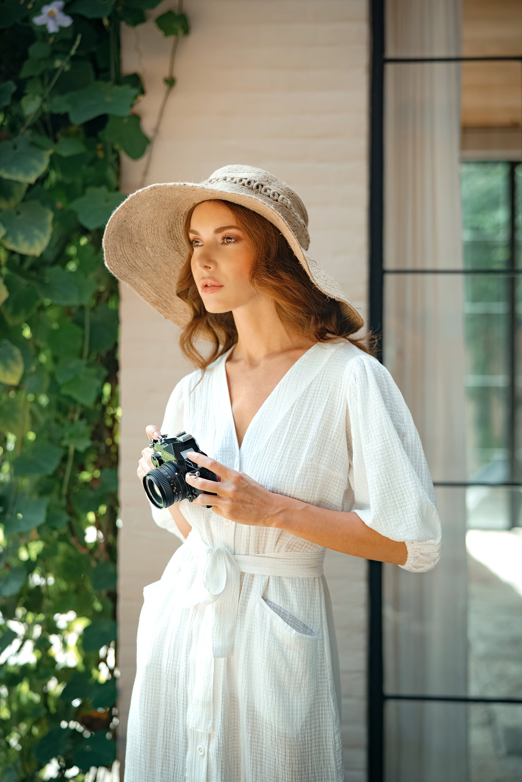 Woman wearing Meghan Crinkle Midi Dress in off-white outdoors