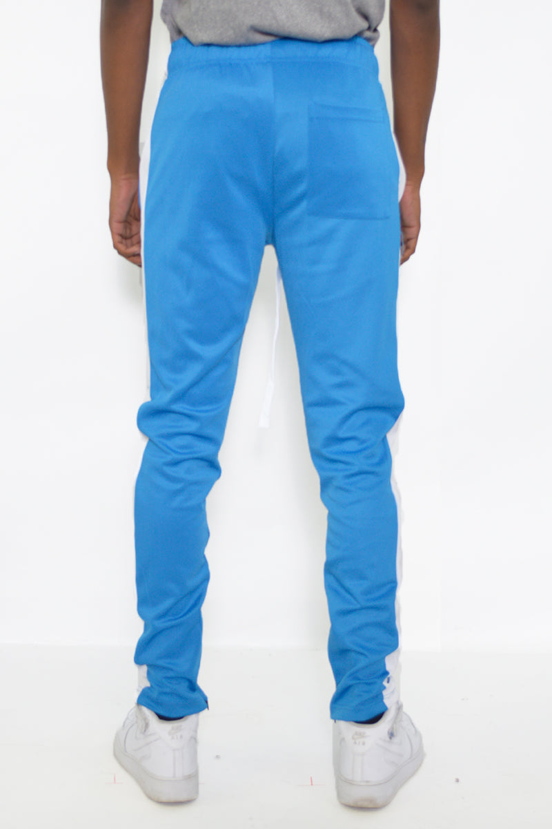Back view of slim fit track pants with sleek stripe detail