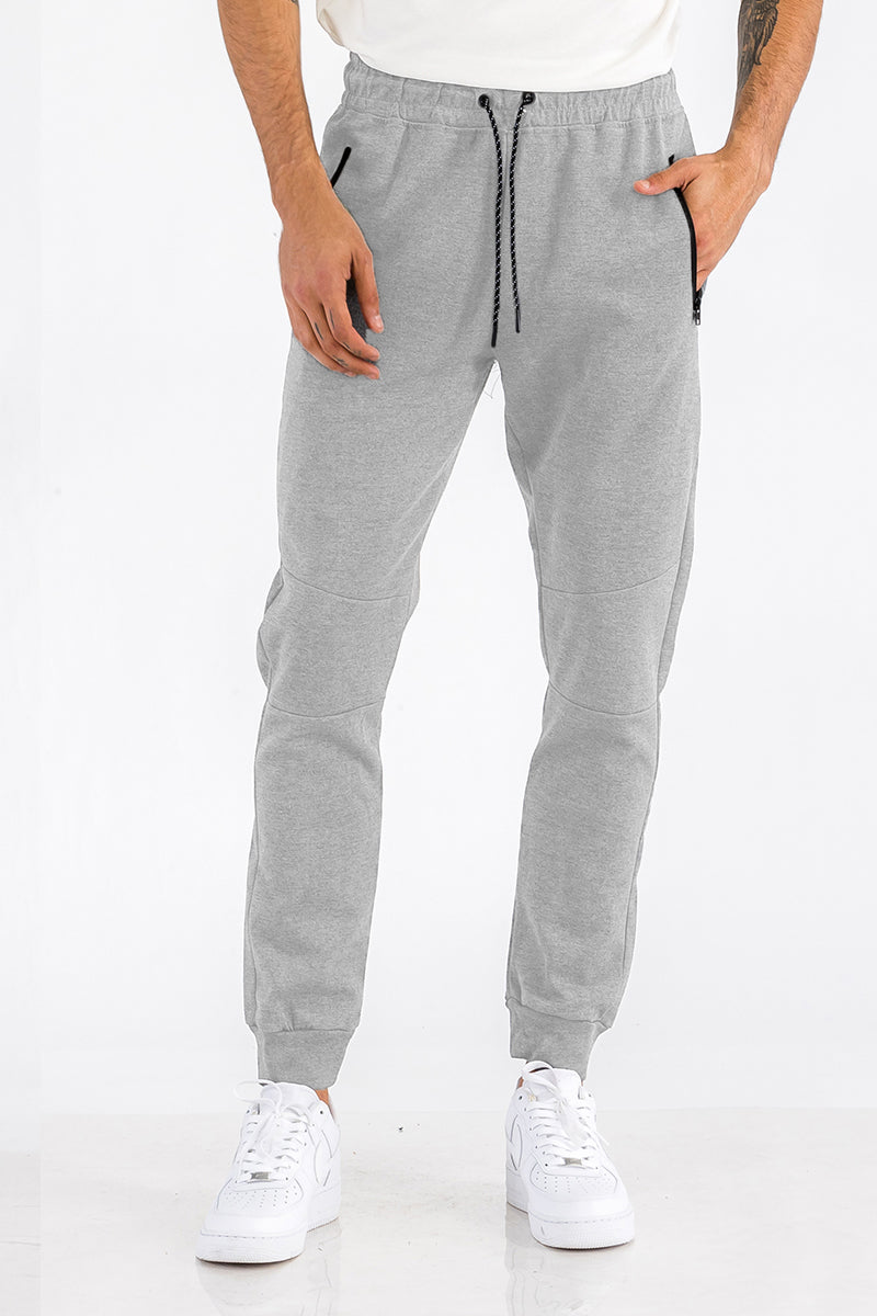 Side view of joggers with elastic ankles and cotton-blend fabric