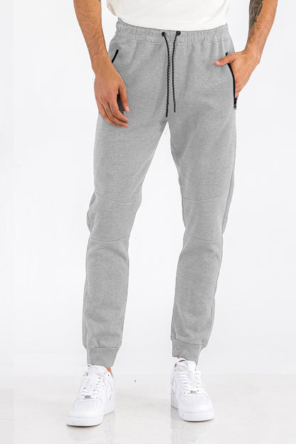 Side view of joggers with elastic ankles and cotton-blend fabric