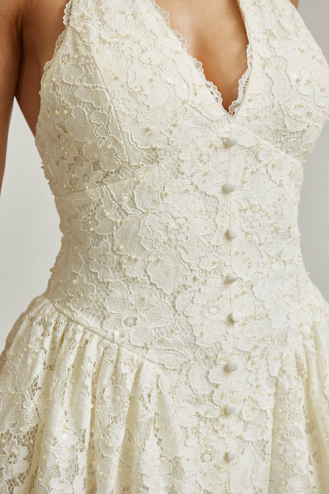 Close-Up of Pearl and Sequin Embellishments on Lace Dress