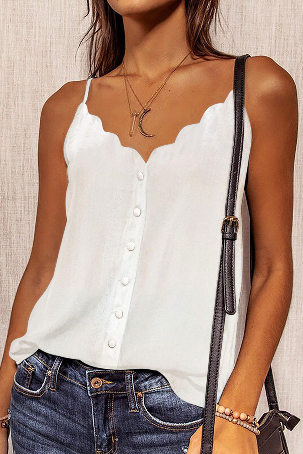 White V-neck summer vest with button detail and spaghetti straps