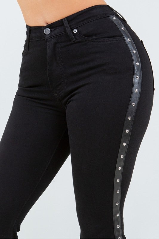 Close-up of studded side detail on high rise bell bottoms