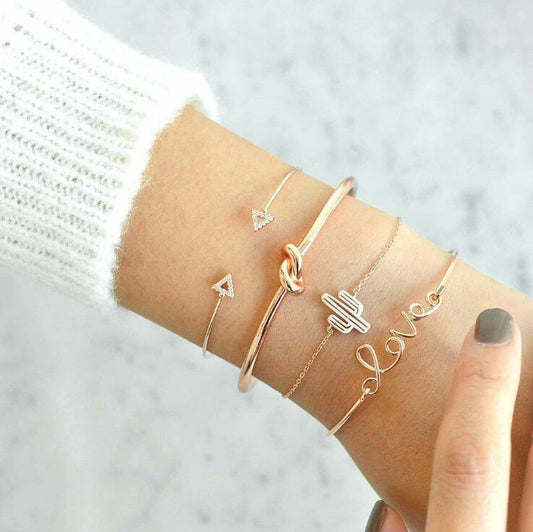 Stack of 4 love-themed charm bracelets with cactus and knot